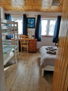 Postelja oz. postelje v sobi nastanitve Sunriseview Cottages