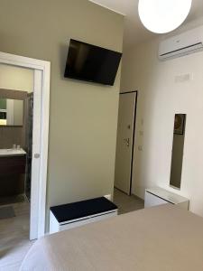 Postel nebo postele na pokoji v ubytování Muralta Suite & Luxury Rooms