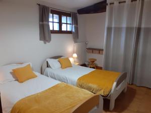 Postel nebo postele na pokoji v ubytování Domaine de la Sauzaie