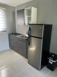 Palm beach Apartments tesisinde mutfak veya mini mutfak