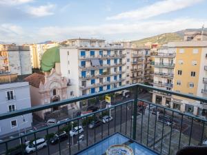 una vista de una ciudad desde un balcón en Rossella Holiday Home, en Sorrento