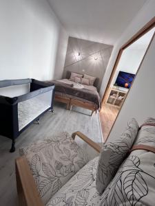 a room with two beds and a piano at Appartement Disneyland Paris in Bussy-Saint-Georges