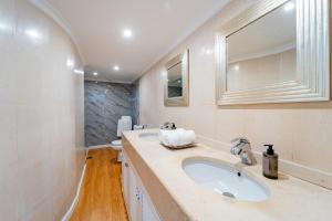 a bathroom with a sink and a toilet at Ana's Place in Funchal +10 photos