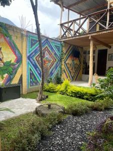 a building with a mural on the side of it at Casa Josep H'i in Sololá