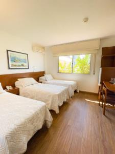 Tempat tidur dalam kamar di Hotel Ajax