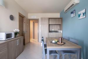 Kuchyň nebo kuchyňský kout v ubytování Tuscasì Aparthotel