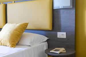 Postel nebo postele na pokoji v ubytování Tuscasì Aparthotel