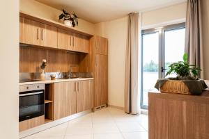 Kuchyň nebo kuchyňský kout v ubytování Tuscasì Aparthotel
