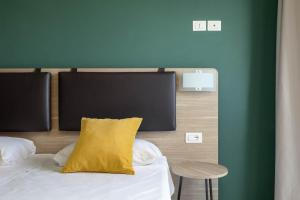 Postel nebo postele na pokoji v ubytování Tuscasì Aparthotel
