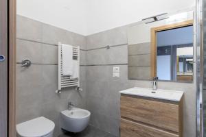 Koupelna v ubytování Tuscasì Aparthotel