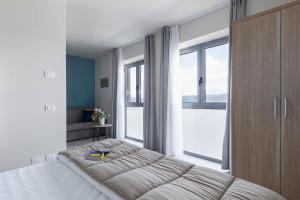Postel nebo postele na pokoji v ubytování Tuscasì Aparthotel