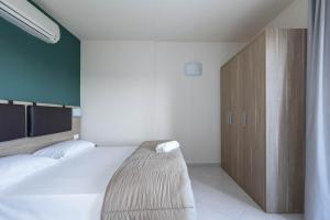 Postel nebo postele na pokoji v ubytování Tuscasì Aparthotel