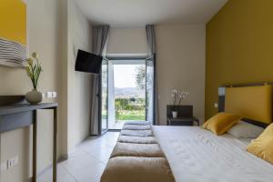 Postel nebo postele na pokoji v ubytování Tuscasì Aparthotel