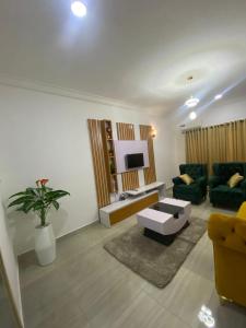 a living room with a couch and a table at Excel suite by Home Glides in Lekki