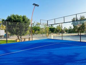 a tennis court with a light on top of it at 1-Bedroom in Forest Island & Oceanside View in Salalah
