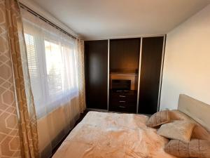 Postel nebo postele na pokoji v ubytování Stella Apartment