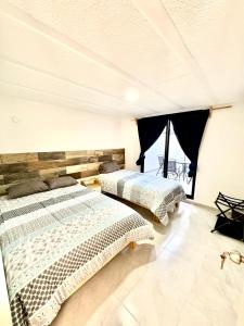 Giường trong phòng chung tại Depa Lunero