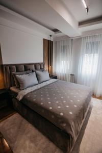 Postel nebo postele na pokoji v ubytování Apartman 37 Aranđelovac