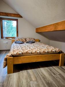 מיטה או מיטות בחדר ב-QESTIA Escape