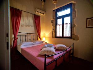 A bed or beds in a room at Dotira