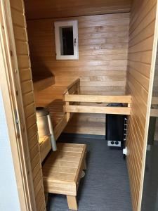 a tiny house with a bunk bed and stairs at Villa Haantie in Längelmäki