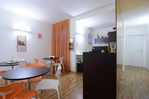 a kitchen and dining room with tables and chairs at B&B Donna Eleonora in Matera