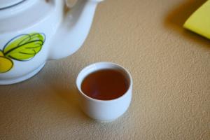 a cup of tea sitting on a table at House Of Jars in Vientiane