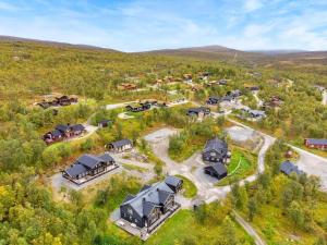 an aerial view of a home in the middle of a field at Feriehus med ti senger på Skaidi in Hammerfest