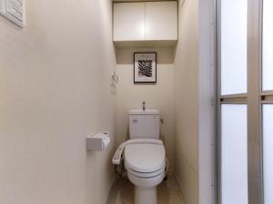 a white toilet in a bathroom with a window at S13-Shibuya center 7 mins to Station, Max 4P涉谷最中心 涉谷站7分 in Tokyo