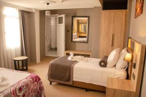 Ένα ή περισσότερα κρεβάτια σε δωμάτιο στο Ephesus Hera