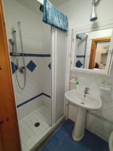 a bathroom with a sink and a shower at Ischia Ponte romantic apartment in the historical center and near the sea in Ischia
