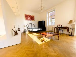 a living room with a coffee table and a couch at Center of Prague Apartment 369 in Prague