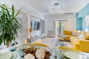 a living room with a couch and a table at Hi-lux Ultracentral - 4BR Superior - Amazing View in Bucharest