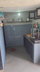 a kitchen with a sink and a counter top at Grotte au bord de mer in Tiznit