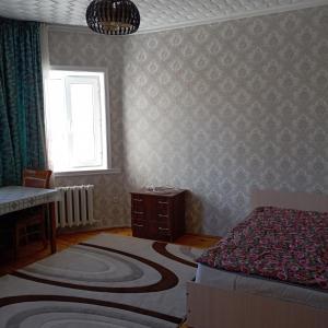 Ένα ή περισσότερα κρεβάτια σε δωμάτιο στο Канышай