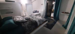Tempat tidur dalam kamar di Le lataniers