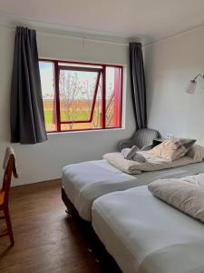 Voodi või voodid majutusasutuse Guesthouse Nypugardar toas