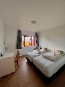Voodi või voodid majutusasutuse Guesthouse Nypugardar toas
