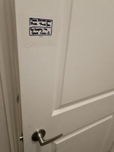 a bathroom door with a sign on it at Cozy, Spacious 2 bdrm basement apartment with kitchenette, sleeps up to 5 in Brampton