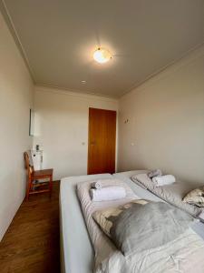 Voodi või voodid majutusasutuse Guesthouse Nypugardar toas