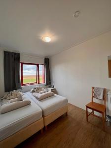 Voodi või voodid majutusasutuse Guesthouse Nypugardar toas