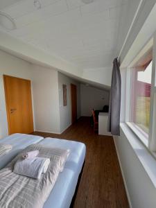 Voodi või voodid majutusasutuse Guesthouse Nypugardar toas