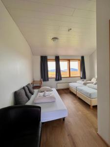 Voodi või voodid majutusasutuse Guesthouse Nypugardar toas