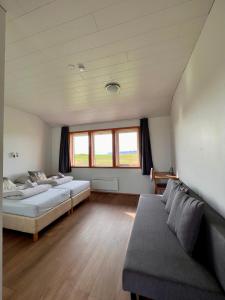 Voodi või voodid majutusasutuse Guesthouse Nypugardar toas