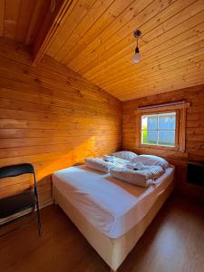 Voodi või voodid majutusasutuse Guesthouse Nypugardar toas