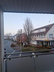 a view of a city street from a balcony at Cozy Apartment: Design Superior Suite Zentral - Küche - Balkon in Cloppenburg