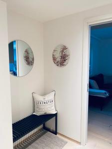 a room with two mirrors and a pillow on a wall at Leilighet ved Slottsfjellet in Tønsberg