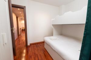 Postel nebo postele na pokoji v ubytování Apartment Forum IV