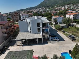 an aerial view of a house with a parking lot at Apartments DEA in Bar