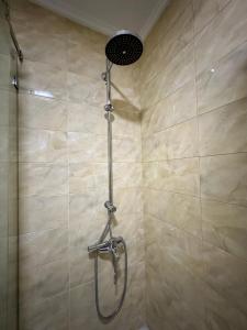 a shower with a shower head in a bathroom at Riverside 2 in Tetouan +13 photos